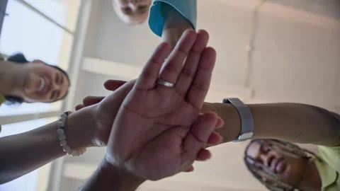 Diverse Colleagues Stacking Hands in Circle for Teamwork Stock Footage 338332112