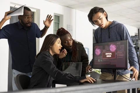 Diverse Colleagues Troubleshooting Technical Failure During Code Review 스톡 사진