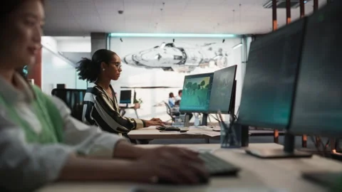 Diverse Colleagues Using Computers In Gamedev Office Stock Footage 255796147