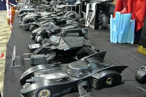 A Diverse Collection of Batman Action Figures and Batmobile Miniatures Stock Photos