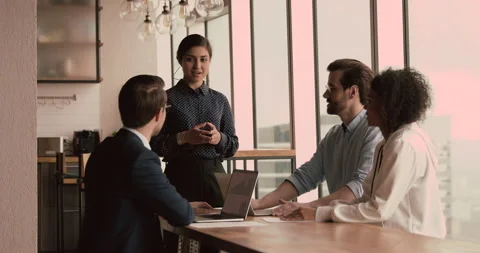 Diverse company staff listen Indian ceo during meeting in office Stock Footage