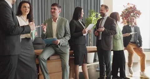 Diverse corporate team networking and collaborating during casual office Stock Footage 338394724
