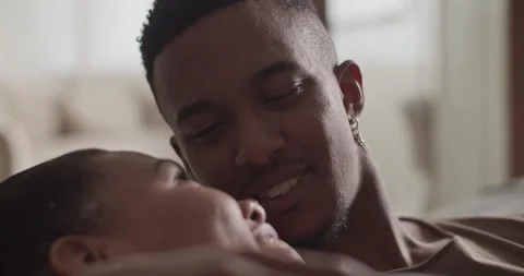 Diverse couple cuddling on sofa Stock Footage 181704254