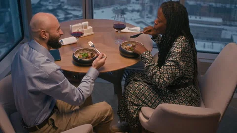 Diverse Couple Dining at Restaurant with Panoramic City View Vidéo 303953846