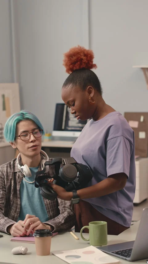 Diverse Couple of Software Developers Examining VR Headset Stock Footage 240919884
