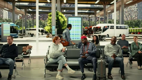 Diverse couple waiting in crowded bus station for long-haul interstate journey Stock Footage 334725059