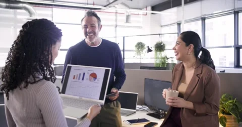 Diverse coworkers exploring data in office, presenter angling laptop and Stock Footage 337159656