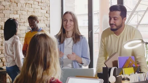 Diverse Creative Colleagues Speaking in Designer Office Stock Footage 115442392