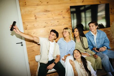 Diverse creative team enjoying a lighthearted selfie moment at work Stock Photos