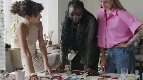 Diverse Creative Team of Women Collaborating in Modern Office Stock Footage 345818533