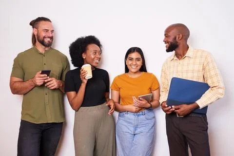 Diverse creative tech team lean against wall and take a break, talking smiling Stock Photos