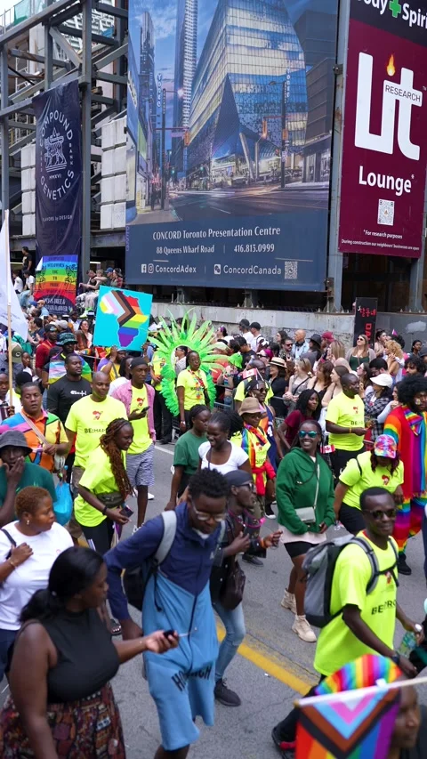 Diverse Crowd Marching with Rainbow Flags at Pride Parade Toronto Video stock 332018091