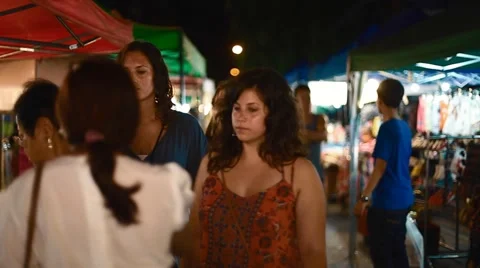 Diverse crowd walking through night market Stock Footage 65173744