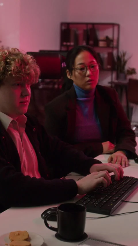 Diverse Cybersecurity Analysts Managing Data Breach in Office Stock-Footage 347289303