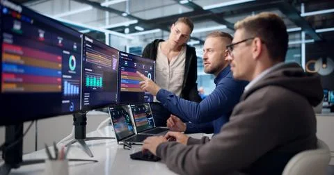 Diverse Cybersecurity Team Analyzes Data To Detect And Stop Threats. Stock Photos