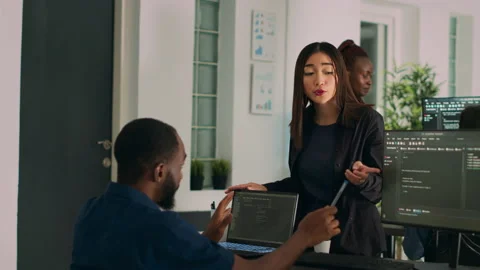 Diverse database developers doing highfive gesture with colleague programer Stock Footage 231448577