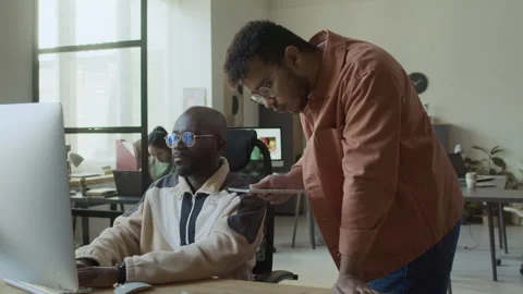 Diverse Developers Discussing Error in Code while Working on Project Video stock 293123271