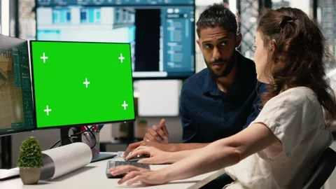 Diverse developers plan architectural structures with isolated screen Stock Footage 316794975