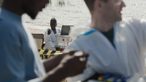 Diverse Ecologists Conducting Water Analysis for Pollution Study Stock Footage 344721364