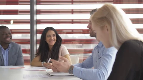Diverse employees exchanging the information about the project in a meeting Stockbeeldmateriaal 73883825