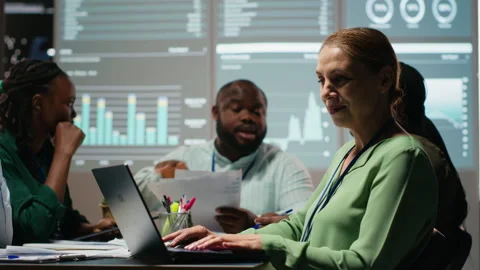Diverse employees team developing a business strategy aligned with objectives Stock Footage 314239570