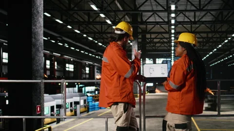 Diverse engineers analyzes robotics software for industrial component Stock Footage 330376819