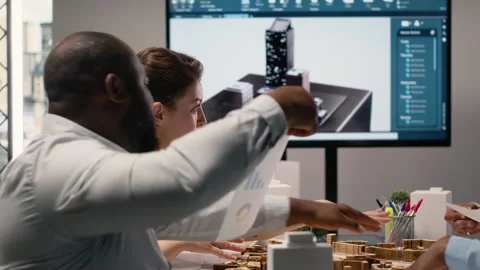 Diverse engineers team go over structural real estate city planning Stock Footage 316641623