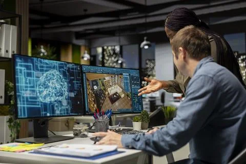 Diverse engineers using AI neural networks to help create interior design 스톡 사진