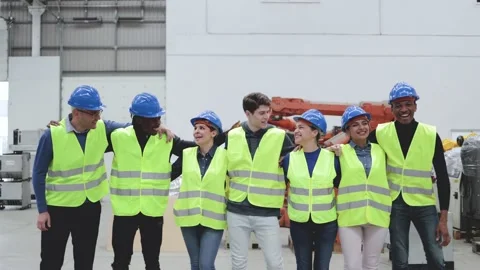 Diverse engineers working inside automation and robotics facility - Industrial t Stock Footage 224564755