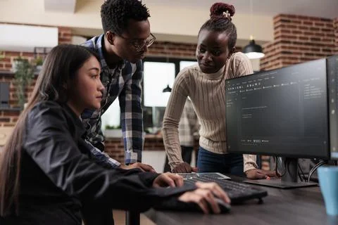 Diverse ethical hacking group defending database system by developing advanced Stock Photos