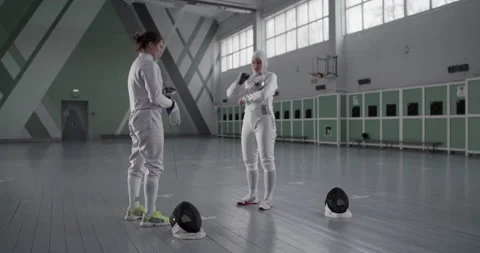 Diverse female fencers preparing for training Video stock 224967983
