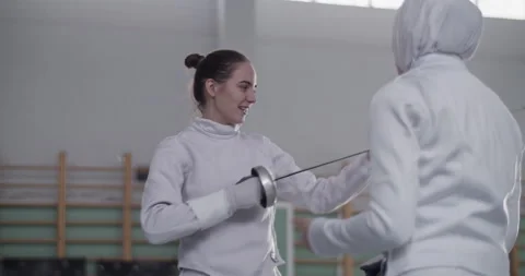Diverse female fencers talking during training Stock Footage 224965985