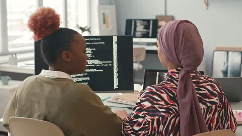 Diverse Female Programmers Coding at Workplace Stock Footage 241266035