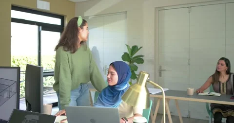 Diverse female team collaborating on 3D floorplan at desk for design review, Stock Footage 345062891