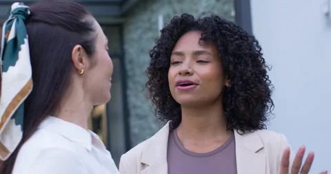 Diverse female team making eye contact by glass door, African American woman Stock Footage 344386318