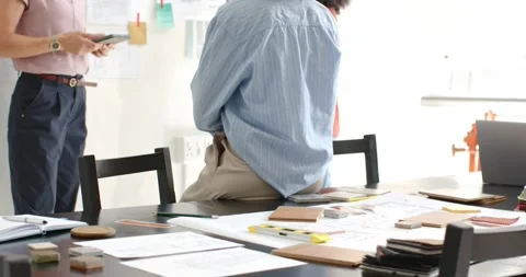 Diverse female team moving to studio wall after colleague gesturing with tablet, Stock Footage 340965206