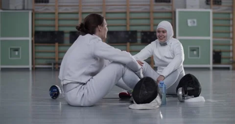 Diverse fencers chatting after training Stock Footage 224961799