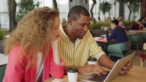 Diverse freelancers starting to work on project in cafe Stock Footage 142484890