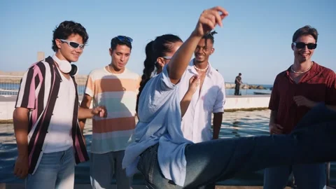 Diverse friends dancing and having fun at a summer seaside party Stock Footage 345197208