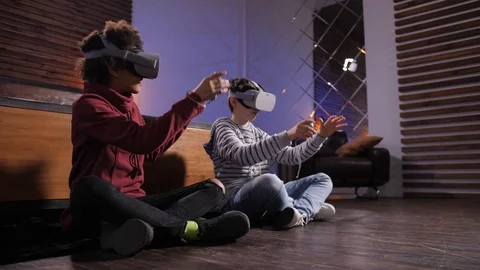 Diverse friends exploring virtual reality at home Stock Footage 125409815