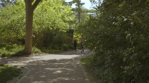 Diverse Friends Running in Park while Black Man Runs By 스톡 동영상 91980977