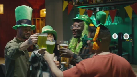 Diverse Friends at St Patricks Day Party with Beer in Pub Stock Footage 261516963