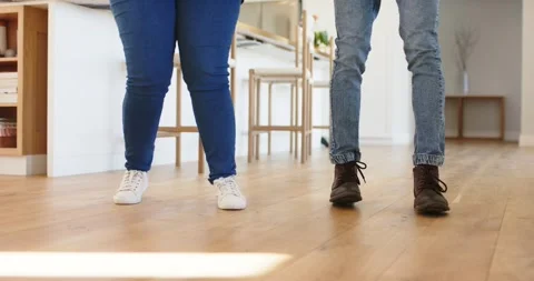 Diverse friends starting dance footwork with synced taps on floor in kitchen Stock Footage 341393456