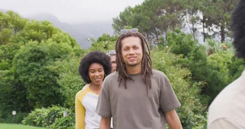 Diverse friends starting front model greeting camera, taking turns posing in Stock Footage 335000468