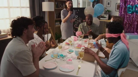 Diverse Friends Supporting Two Blindfolded Young People Trying to Guess Objects Stock Footage 315876532