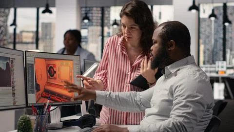 Diverse game engineers developing gaming fantasy model for videogames industry Stock Photos