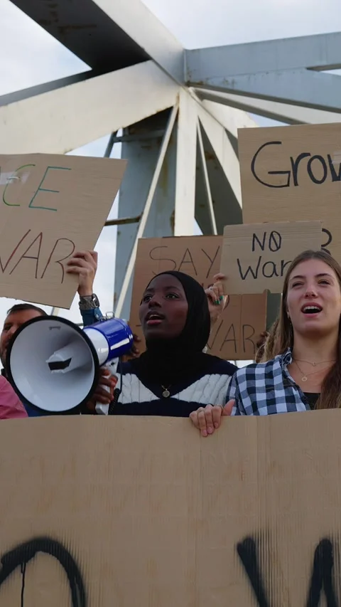 Diverse group of activists people protesting against war and violence. Stock Footage 312235857