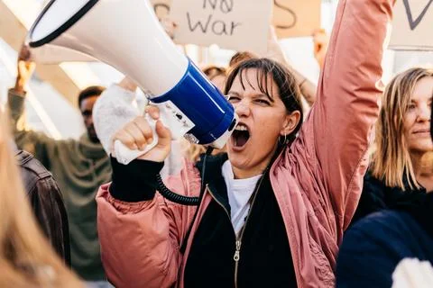 Diverse group of activists people protesting against war and violence. Stock Photos