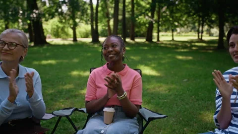 Diverse Group Applauding Men Hugging at Outdoor Therapy Session Stock Footage 344947902