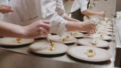 A diverse group of chefs applies the fin... Stock Video Pond5